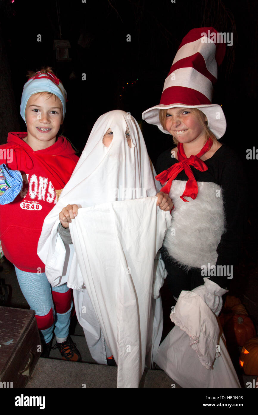 Dr. Seuss Cat in the Hat, Ghost and Thing 1 Halloween characters out for a night of trick and treat. St Paul Minnesota MN USA Stock Photo