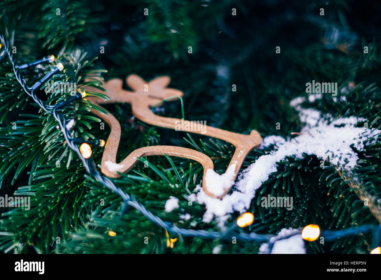 Close-up of reindeer decoration and lights on a Christmas tree Stock Photo