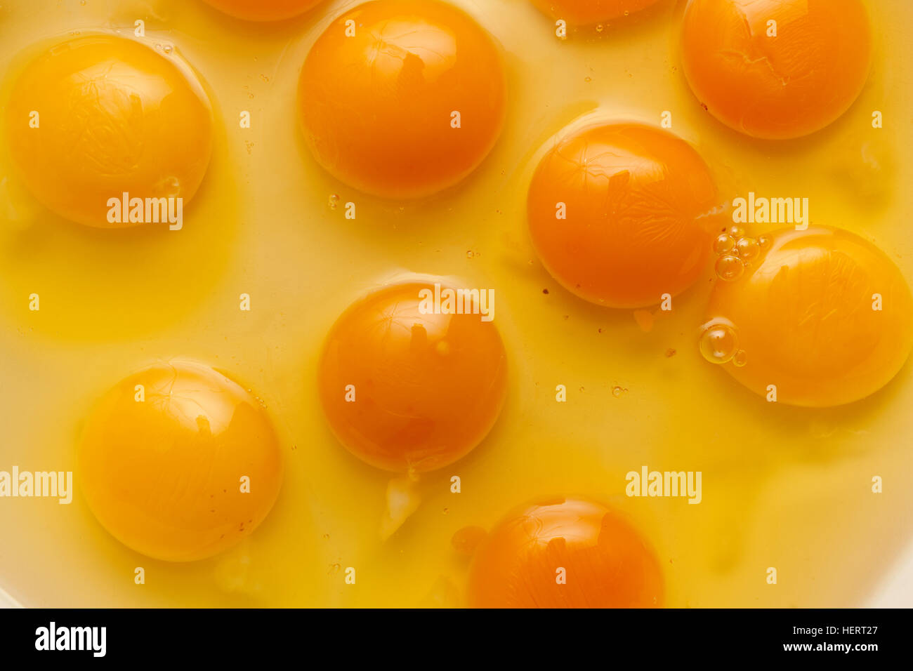 Egg yolk close up background Stock Photo - Alamy