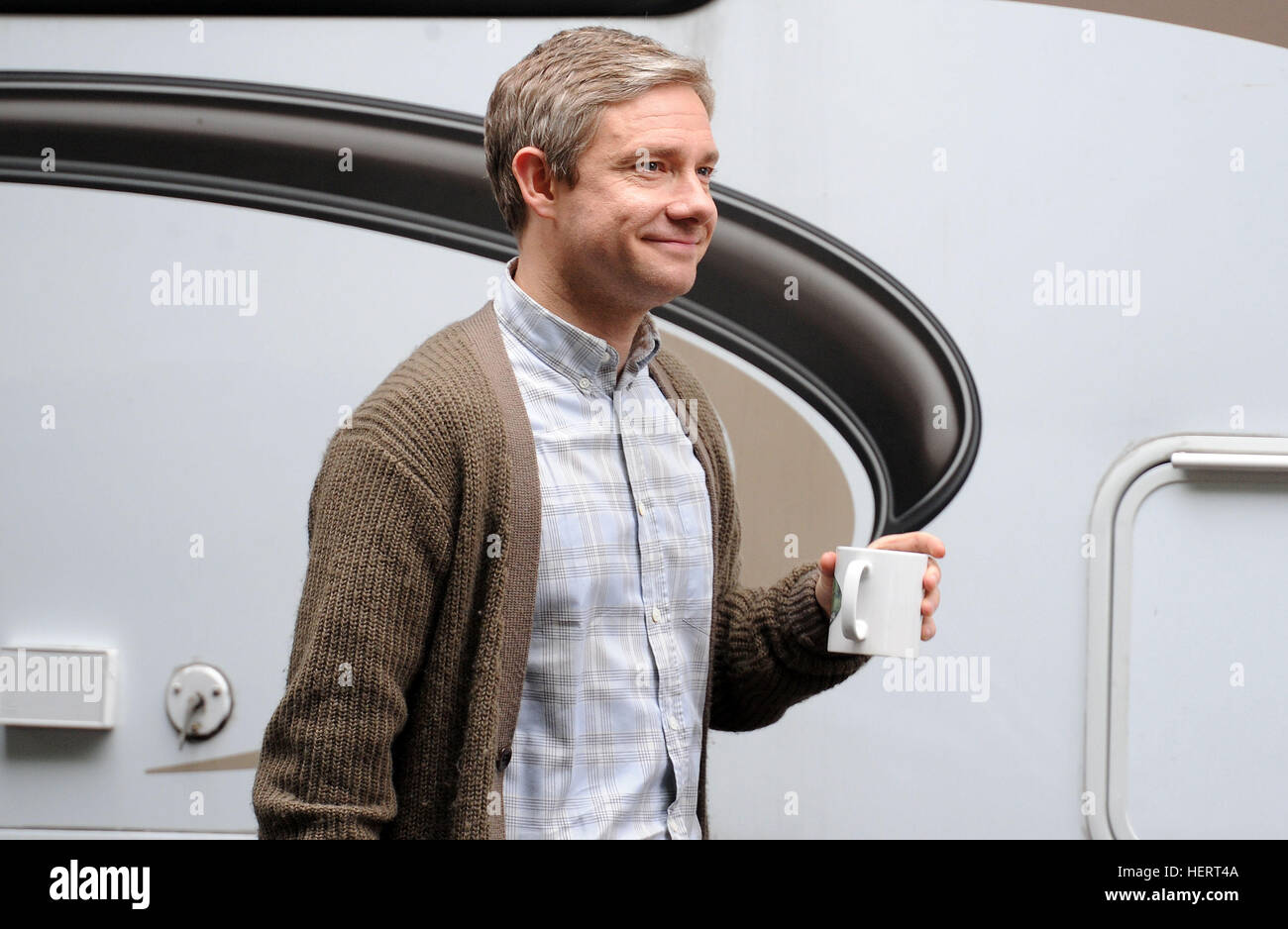 CARDIFF, WALES - AUGUST 17: Martin Freeman spotted on Museum Avenue before filming for BBC drama Sherlock on August 17, 2013 in Cardiff, Wales. (Photo by Matthew Horwood) Stock Photo