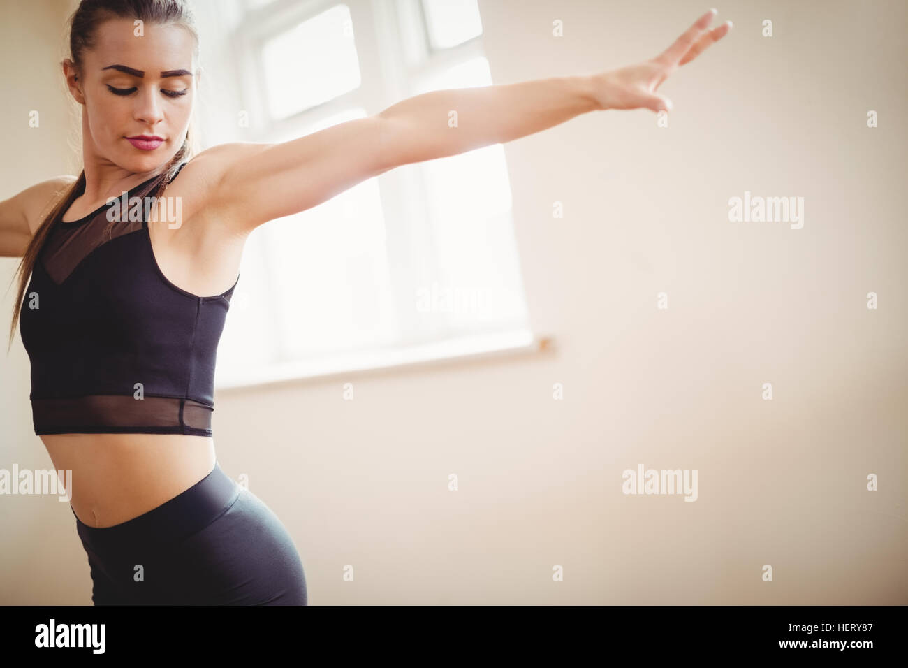 Pretty woman practising hip hop dance in studio Stock Photo