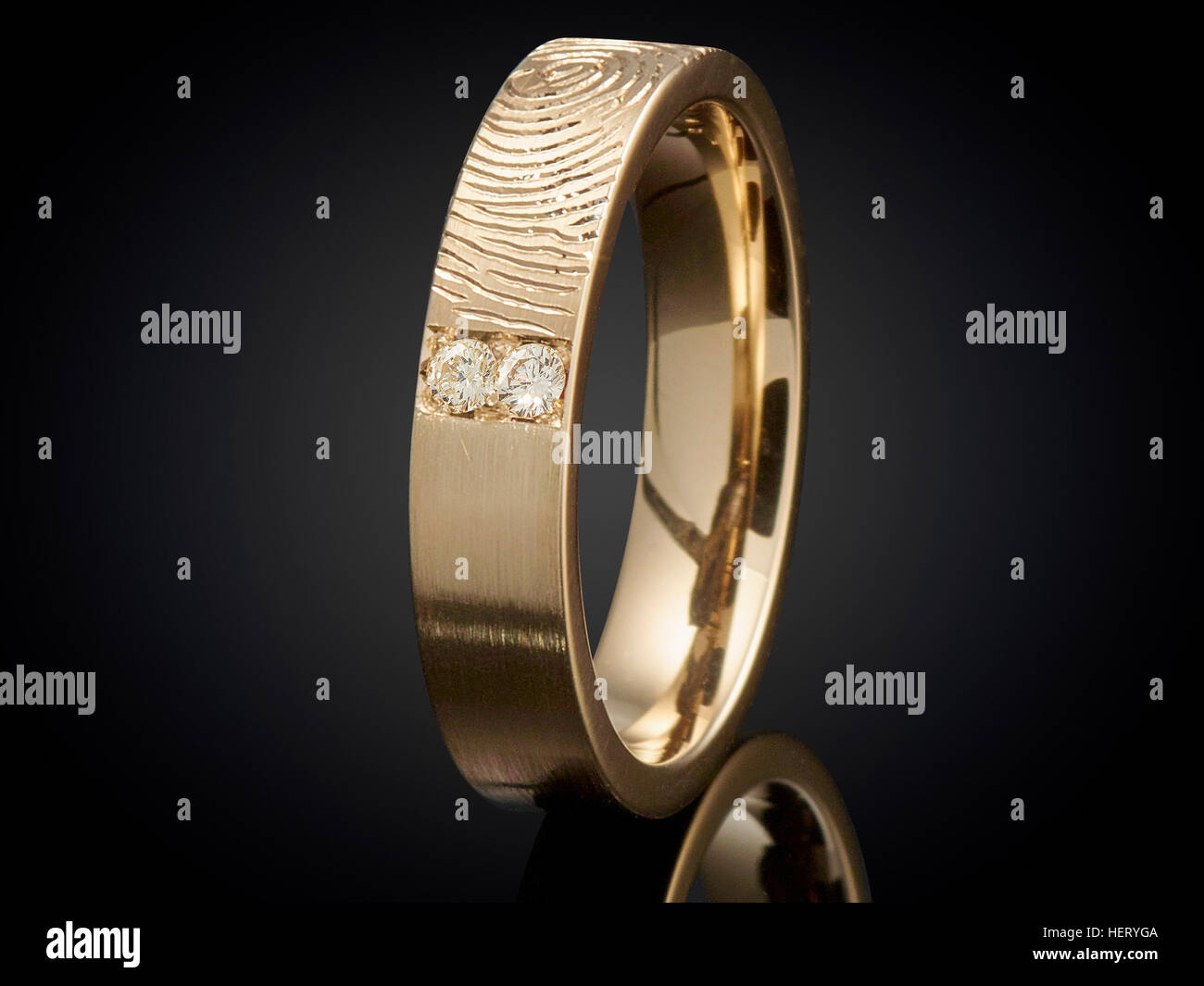 Golden ring with gemstone isolated on black background. Stock Photo
