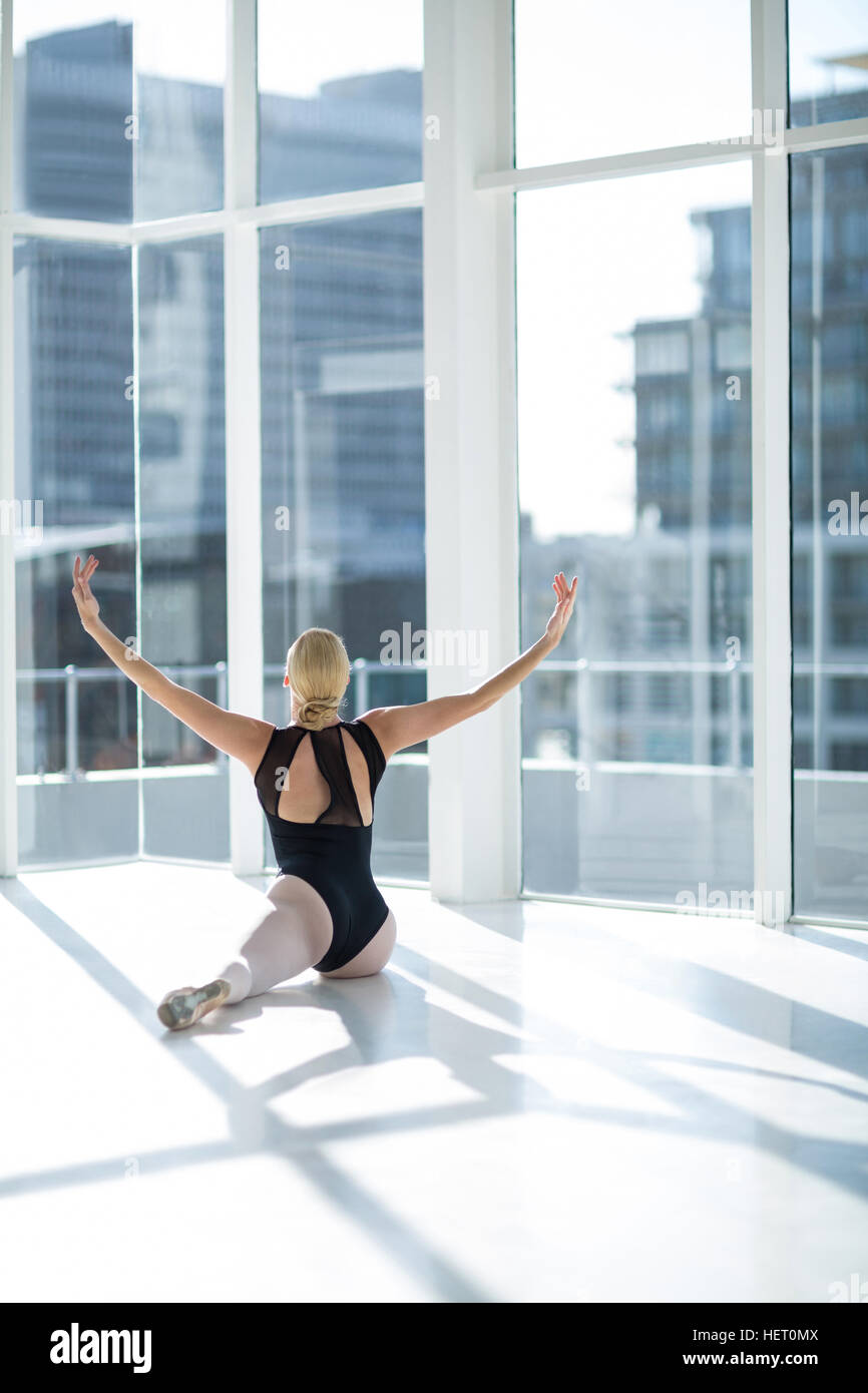 Ballerina performing a split in the studio Stock Photo - Alamy