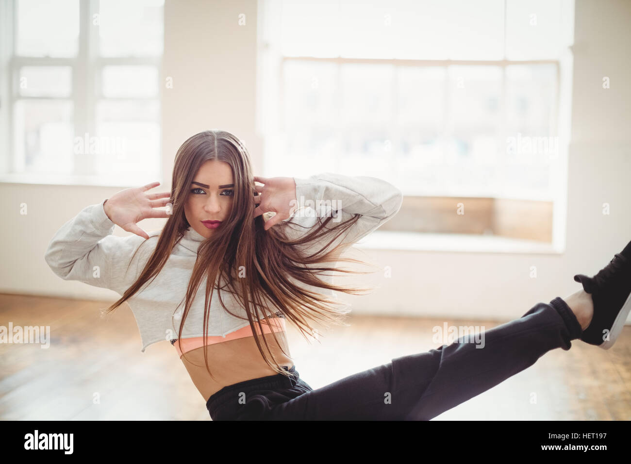 Pretty woman practising hip hop dance in studio Stock Photo