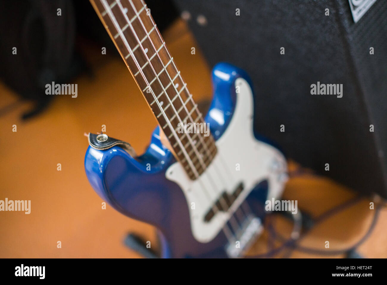 Blue electric bass guitar on the floor for recording Stock Photo Alamy