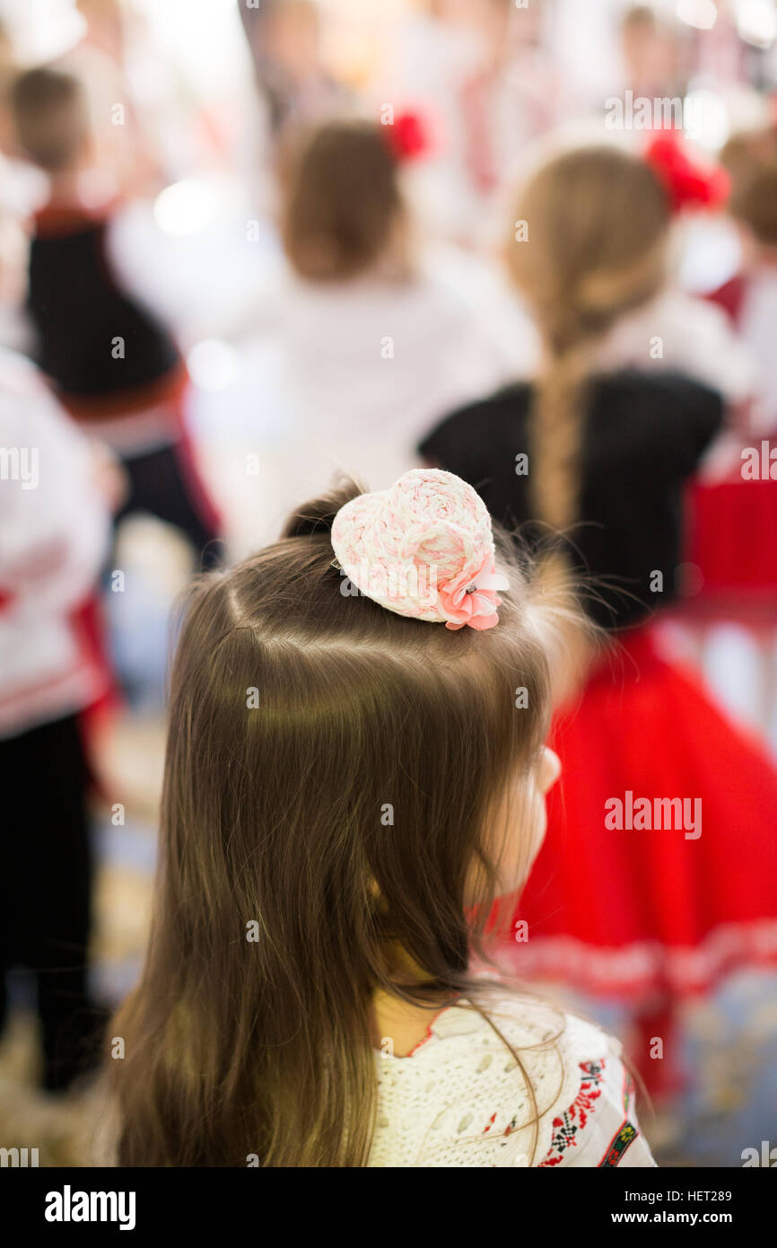 Beautiful hairstyle of a little girl. Focus on her Stock Photo