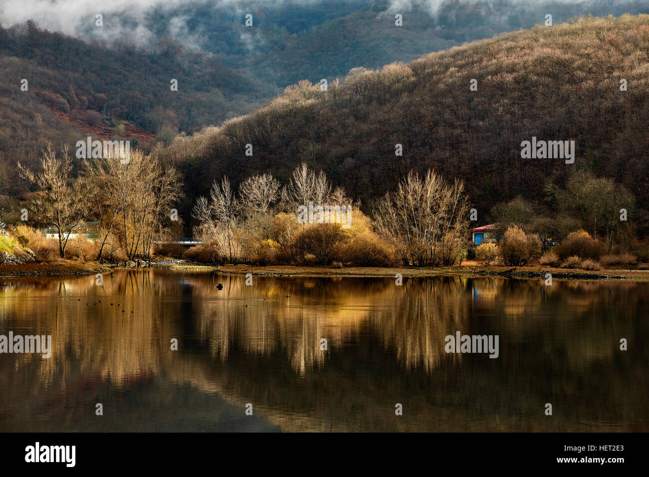 Hills autumn trees reflected in hi-res stock photography and images - Alamy