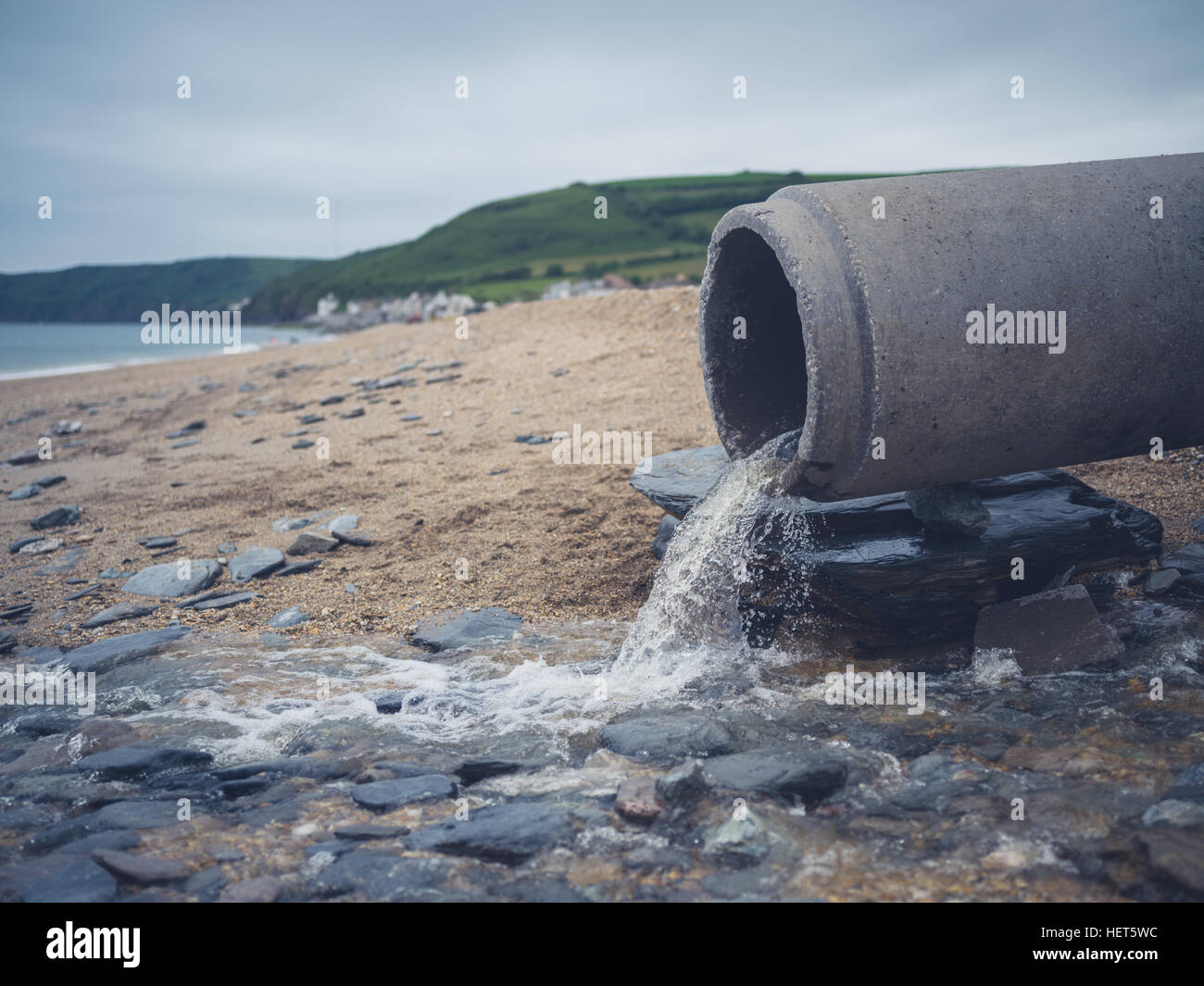 A large sewage pipe on the beach Stock Photo Alamy