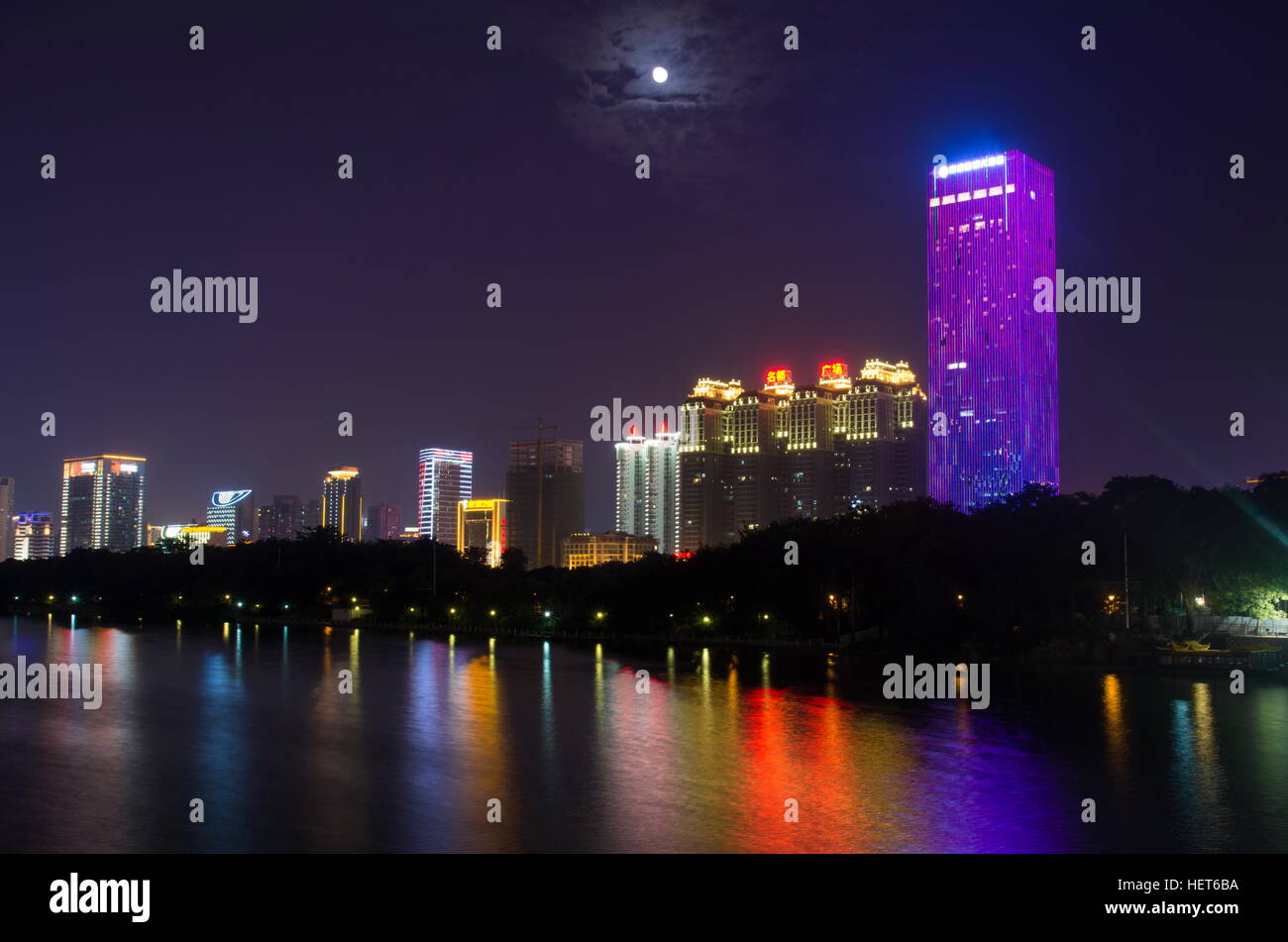 NANNING, CHINA - SEPTEMBER 18: View at the modern business city area with high buildings reflecting in the Nanhu lake. Nanning is the capital city of Stock Photo