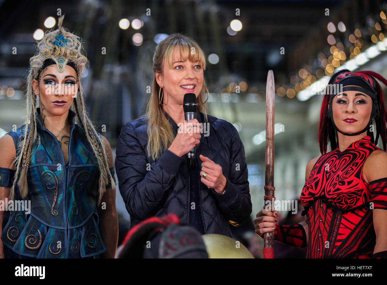 BBC Radio 1 presenter Sara Cox lights up and unveils the St Pancras International Christmas tree. Fans and commuters experiences the performance by the cast of the Cirque du Soleil  Featuring: Sarah Cox, Cirque du Soleil cast Where: London, United Kingdom Stock Photo