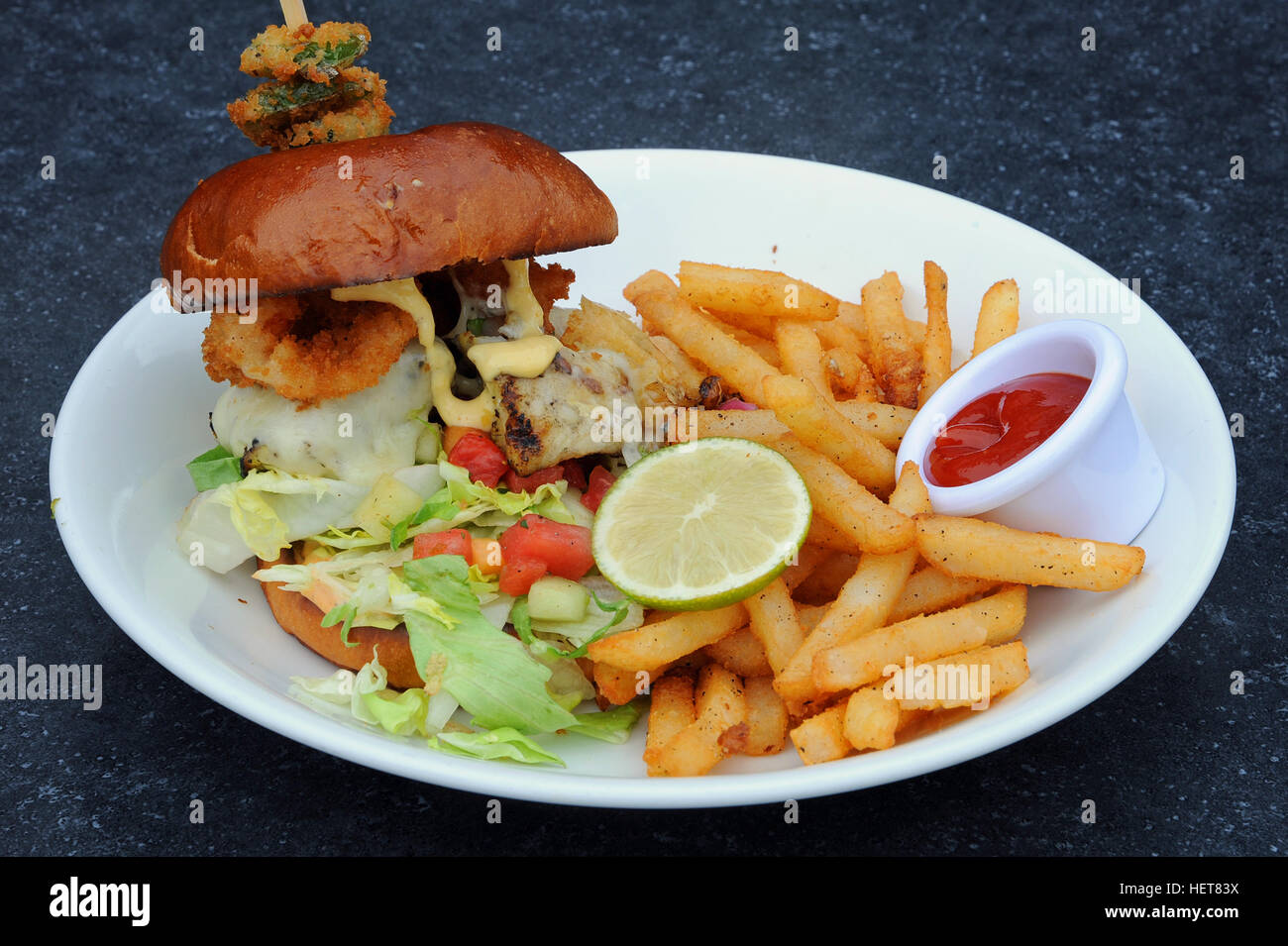 Burger and chips at The Schooner restaurant inTofino, Vancouver Island, British Columbia, Canada Stock Photo