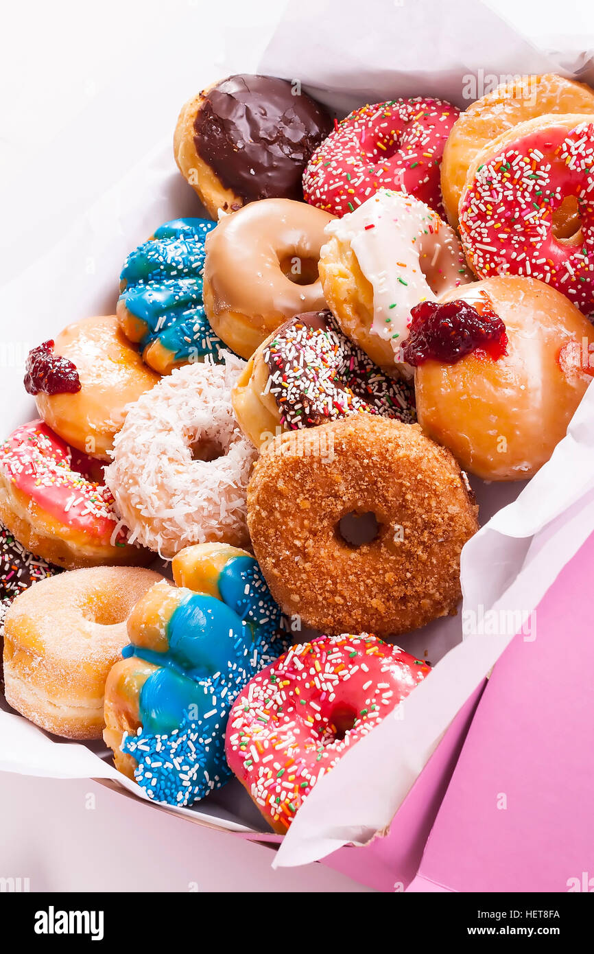 Box of colorful assorted donuts in pink box Stock Photo Alamy