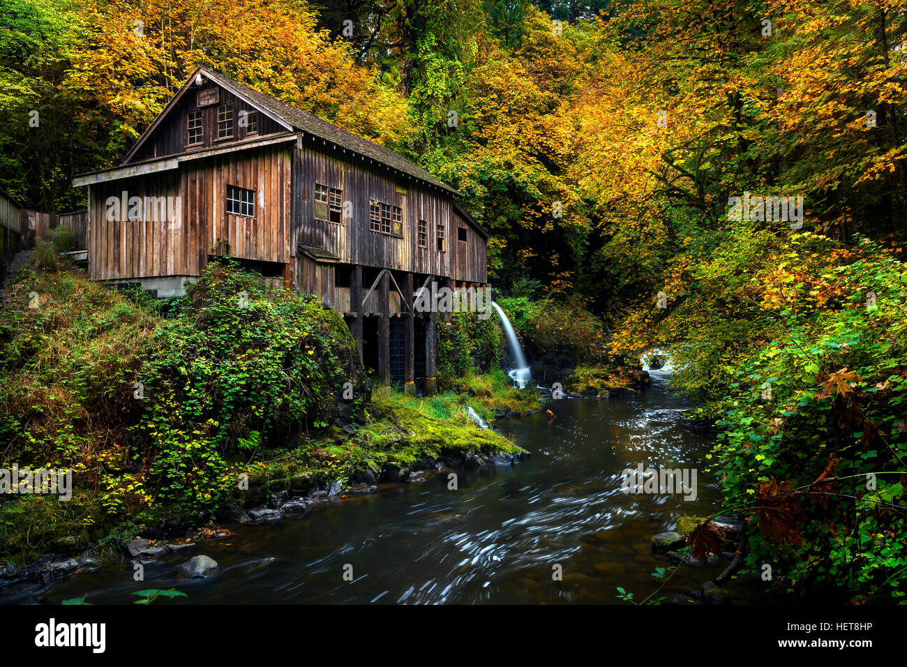Cedar Creek Grist Mill with fall color. Located in Woodlands