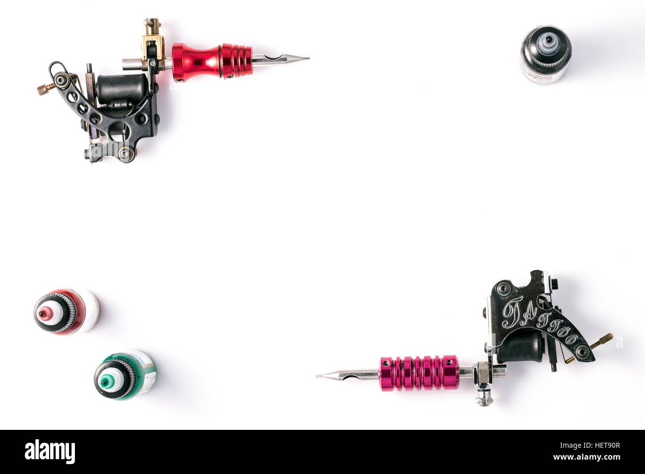 Tattoo machines and three bottles of ink isolated on white background