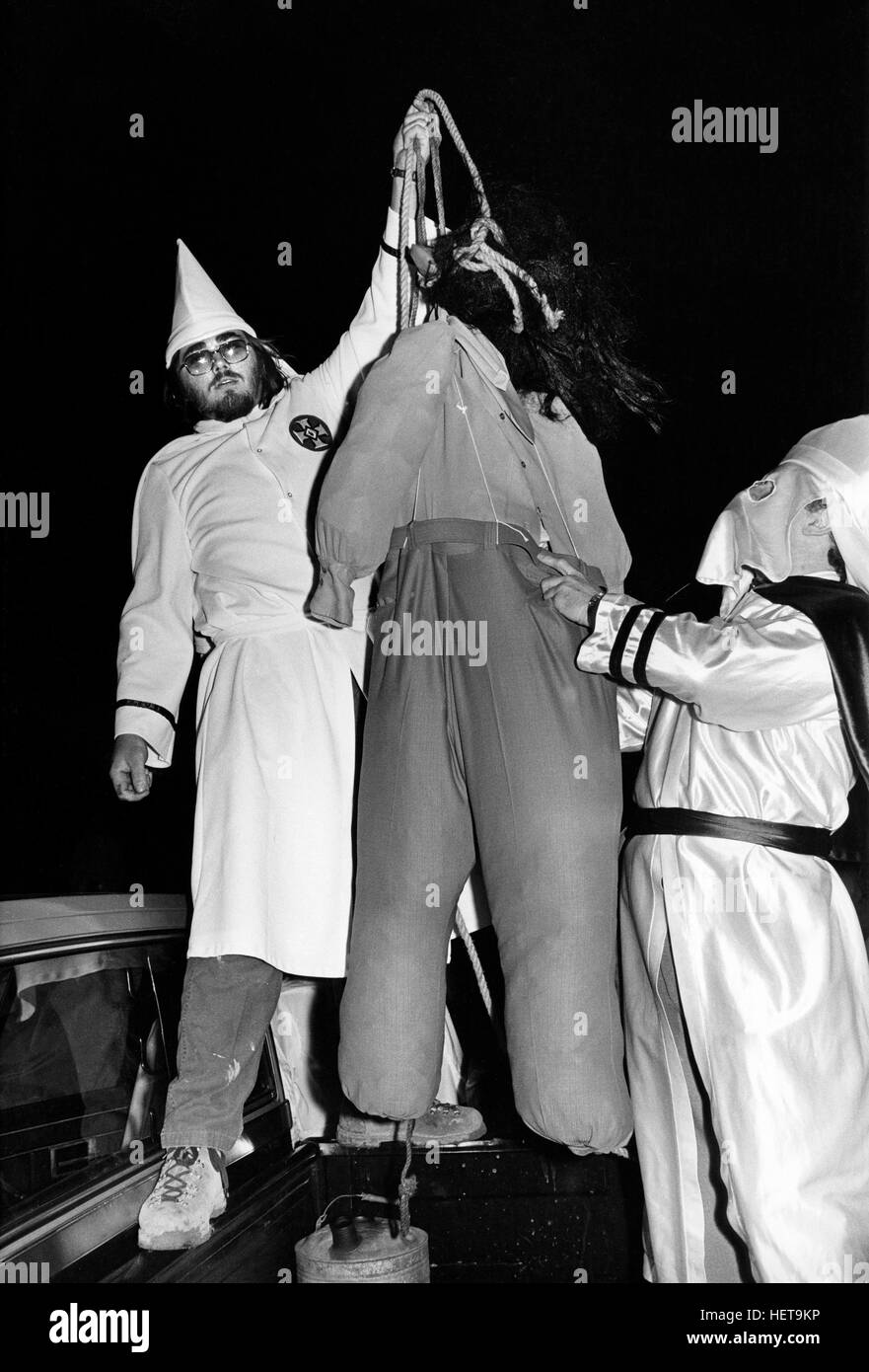 Ku Klux Klan members simulate the lynching of an African American with a gorilla masked dummy at a Klan Rally outside Jackson, Georgia. The rally - held in a rural farm field - attracted about 125 people and attempted to both incite violence against blacks and enlarge the local KKK membership. Stock Photo