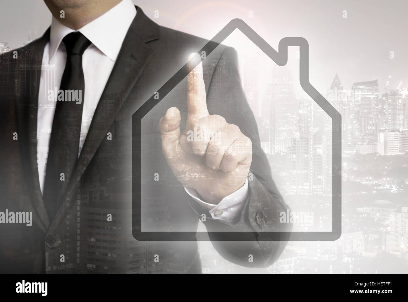 Businessman with city background house concept concept Stock Photo - Alamy