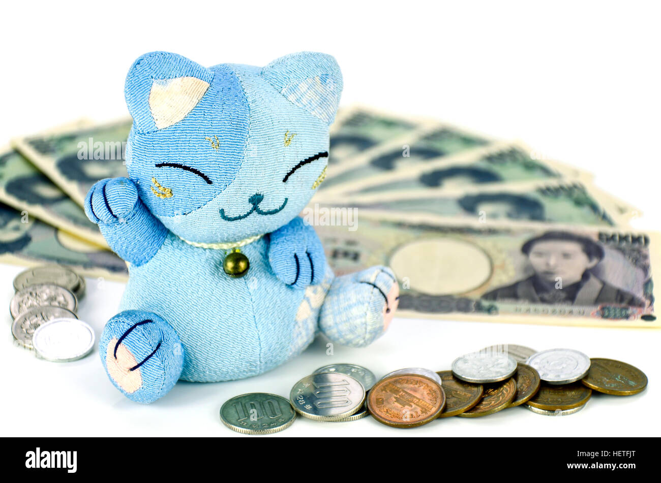 Maneki-neko, the lucky cat and Japanese money. Stock Photo