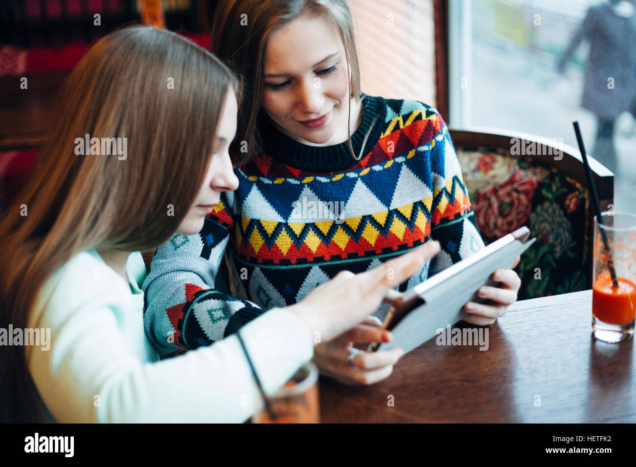Girl friends communicate in a cafe Stock Photo - Alamy