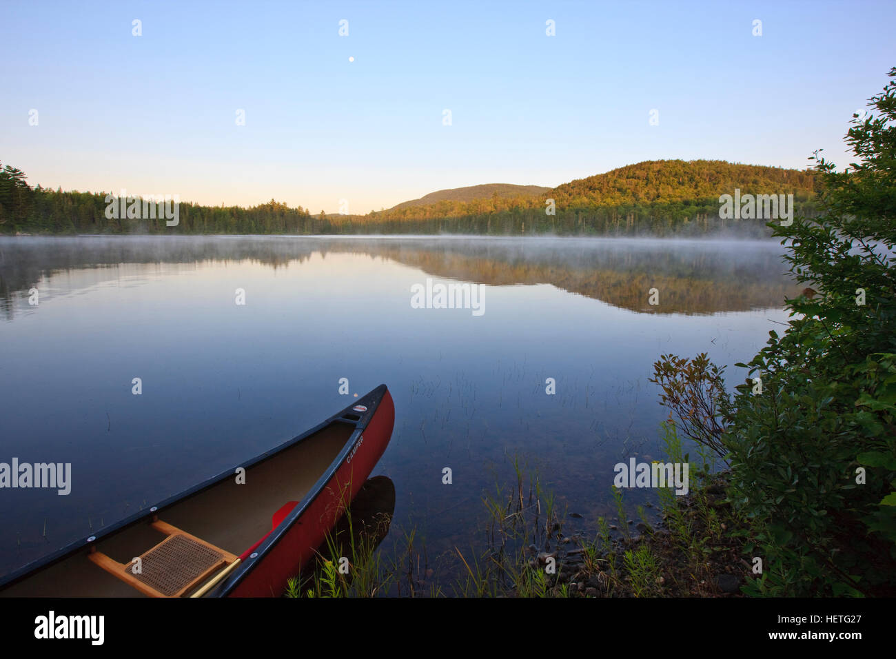 A canoe on Little Greenough Pond in Errol, New Hampshire Stock Photo