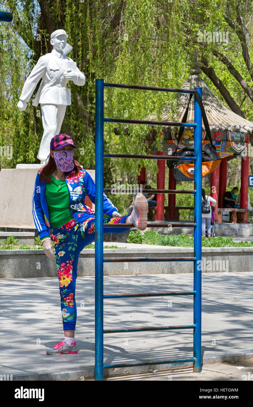 Chinese woman exercising in Zhongshan Park, Yinchuan, Ningxia, China Stock Photo
