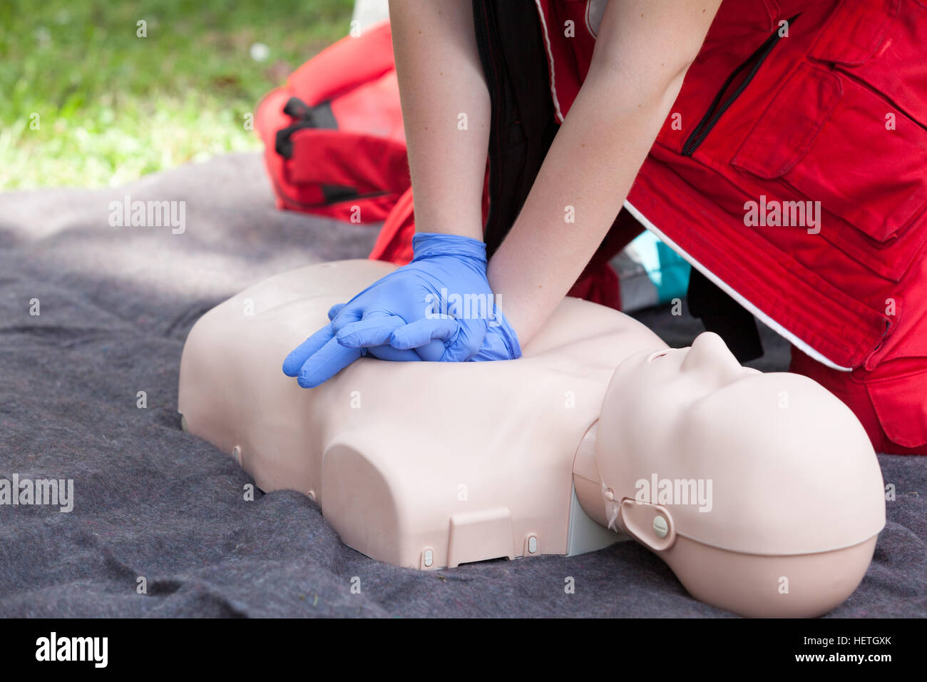 First aid training. Instructor showing CPR on training doll Stock Photo