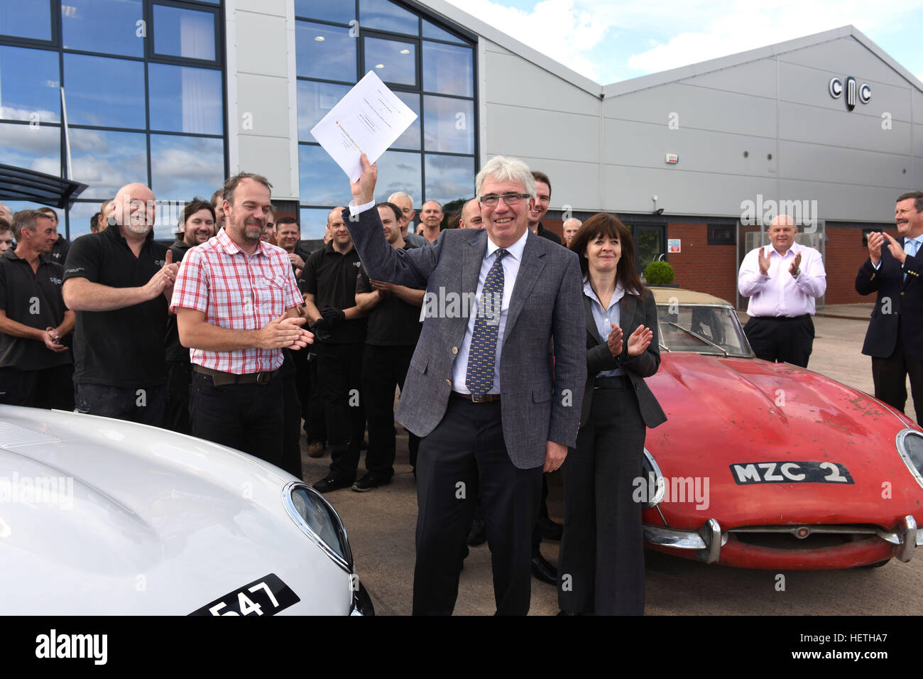 Classic Motor Cars chairman Peter Neumark handing over the company