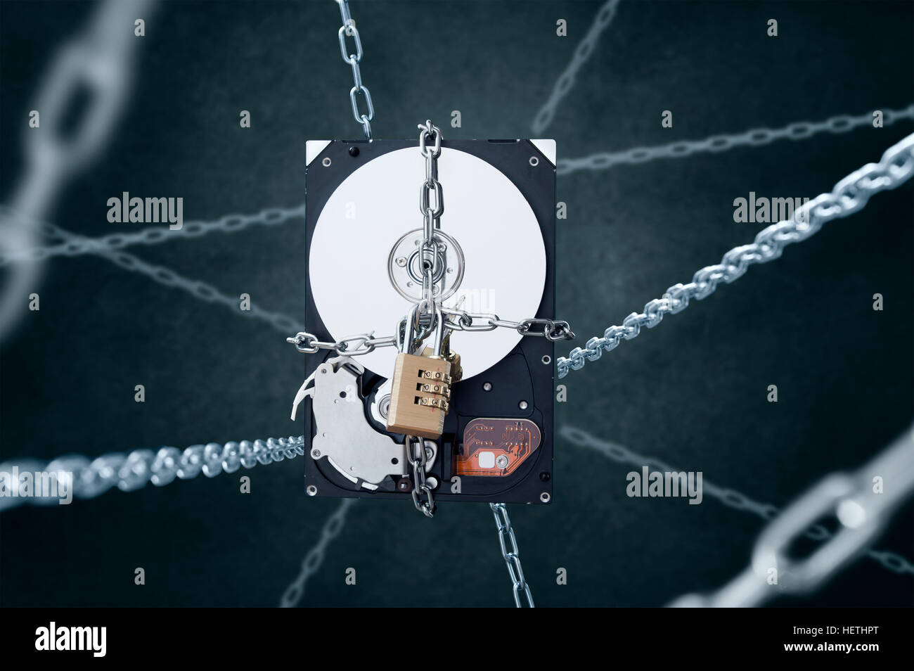 Chained hard disc drive with combination padlock. Conception of data security Stock Photo