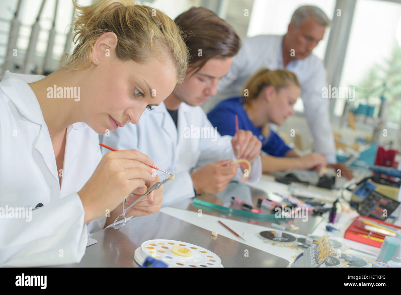 Woman working in dental laboratory Stock Photo Alamy