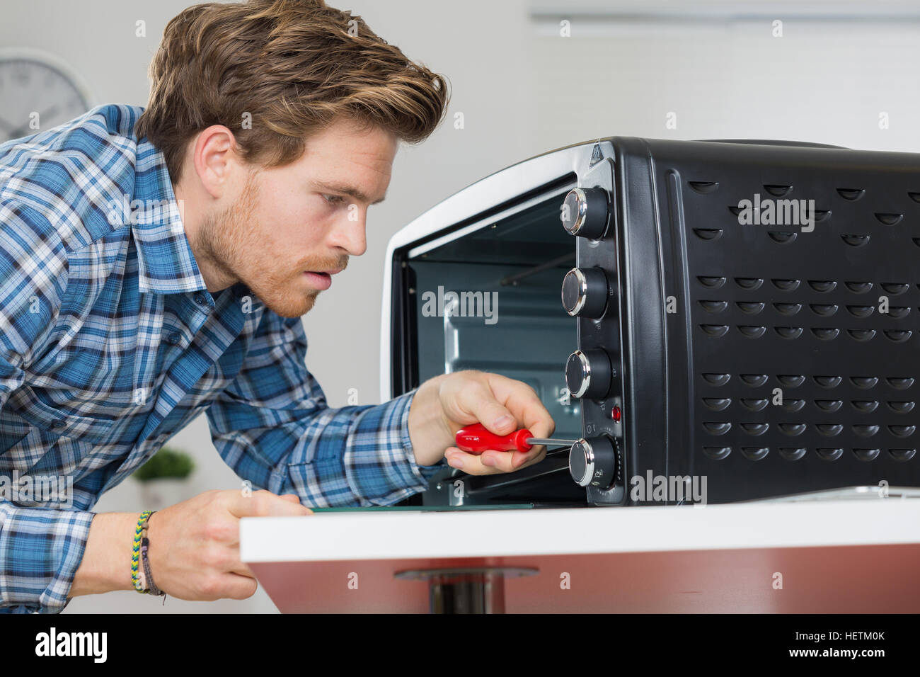 man repairing microwave Stock Photo Alamy