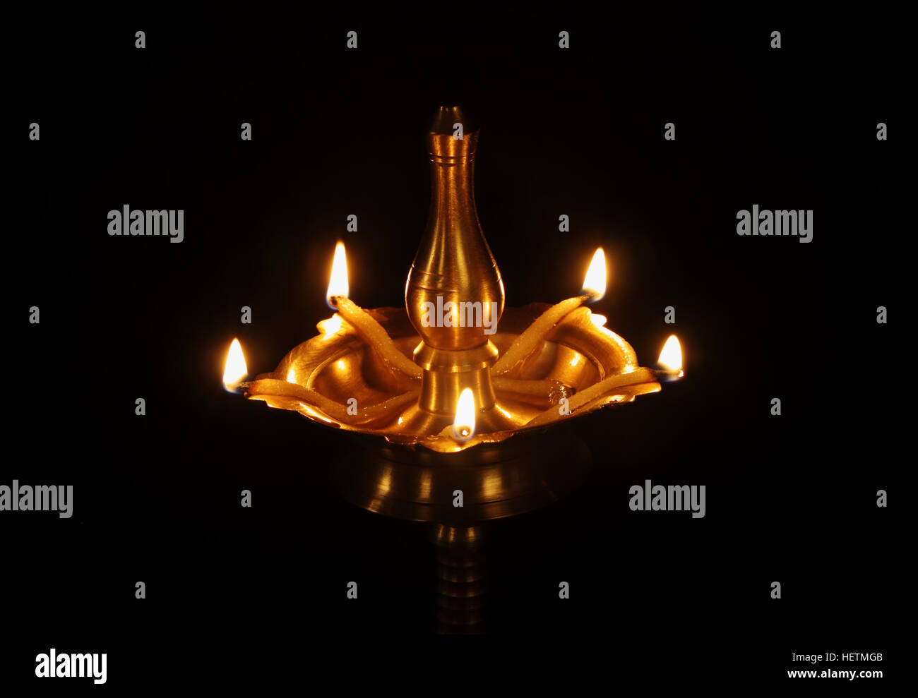 Indian Traditional Oil Lamp with Flame Stock Photo