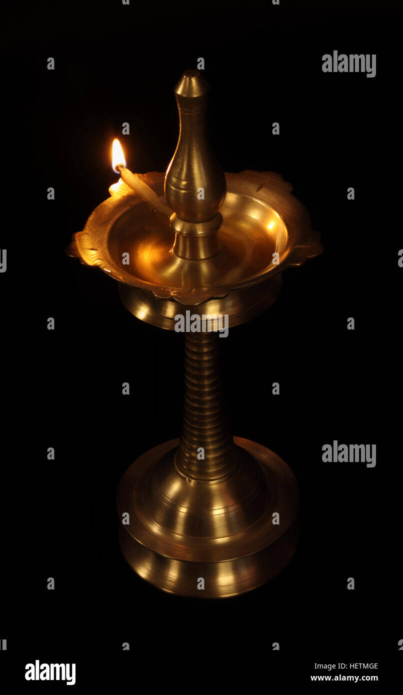 Indian Traditional Oil Lamp with Flame Stock Photo