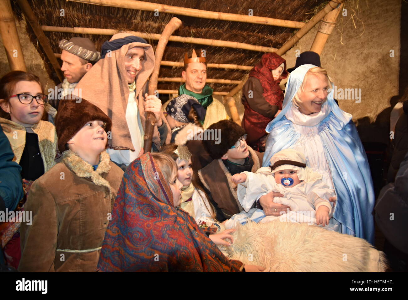 Christmas nativity scene of Jesus birth in an old cottage nearby