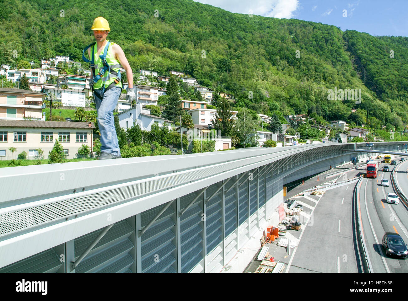 Bissone, Switzerland - 20 May 2010: Workers during the installation of noise barriers on the highway at Bissone on Switzerland Stock Photo