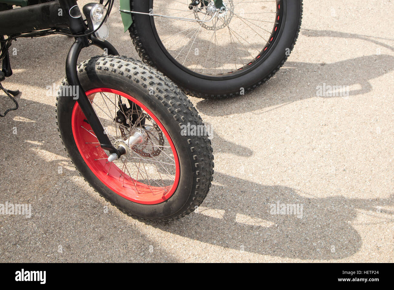 Detail of a bike with huge big wheels on a sunny day Stock Photo Alamy