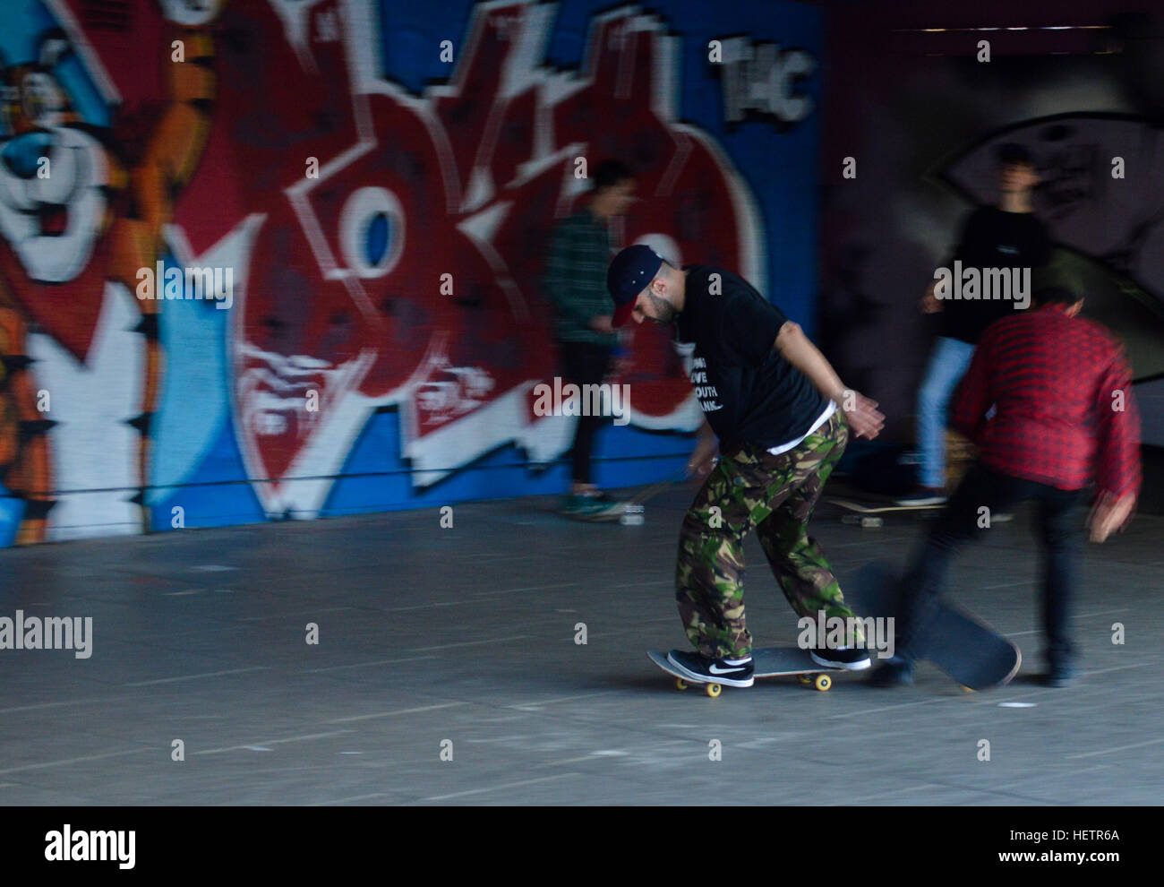 Panning of a skater in a skatepark in the South Bank of the Thames, London. Stock Photo