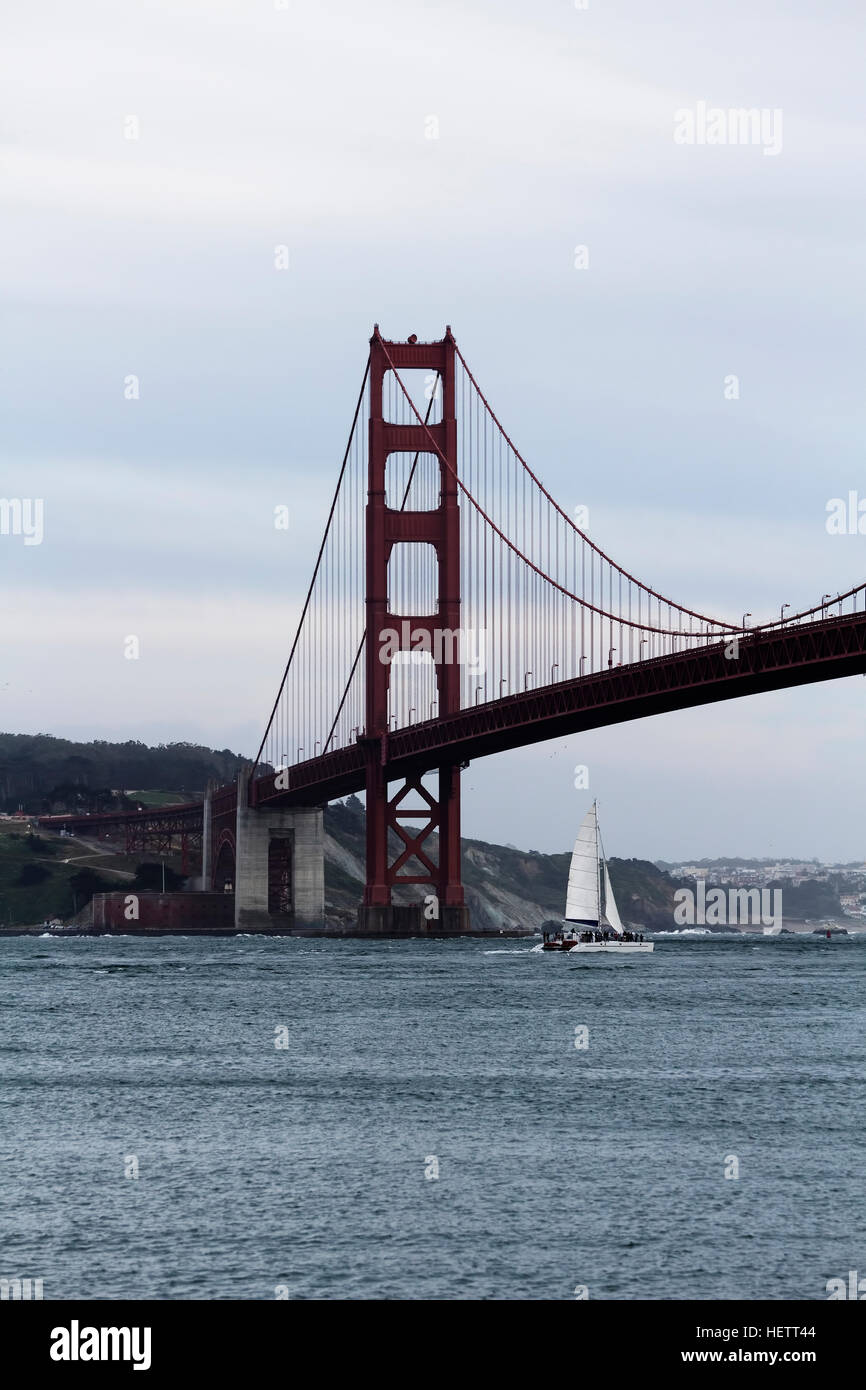 South Tower Of Golden Gate Bridge With Sailboat Underneath Stock Photo
