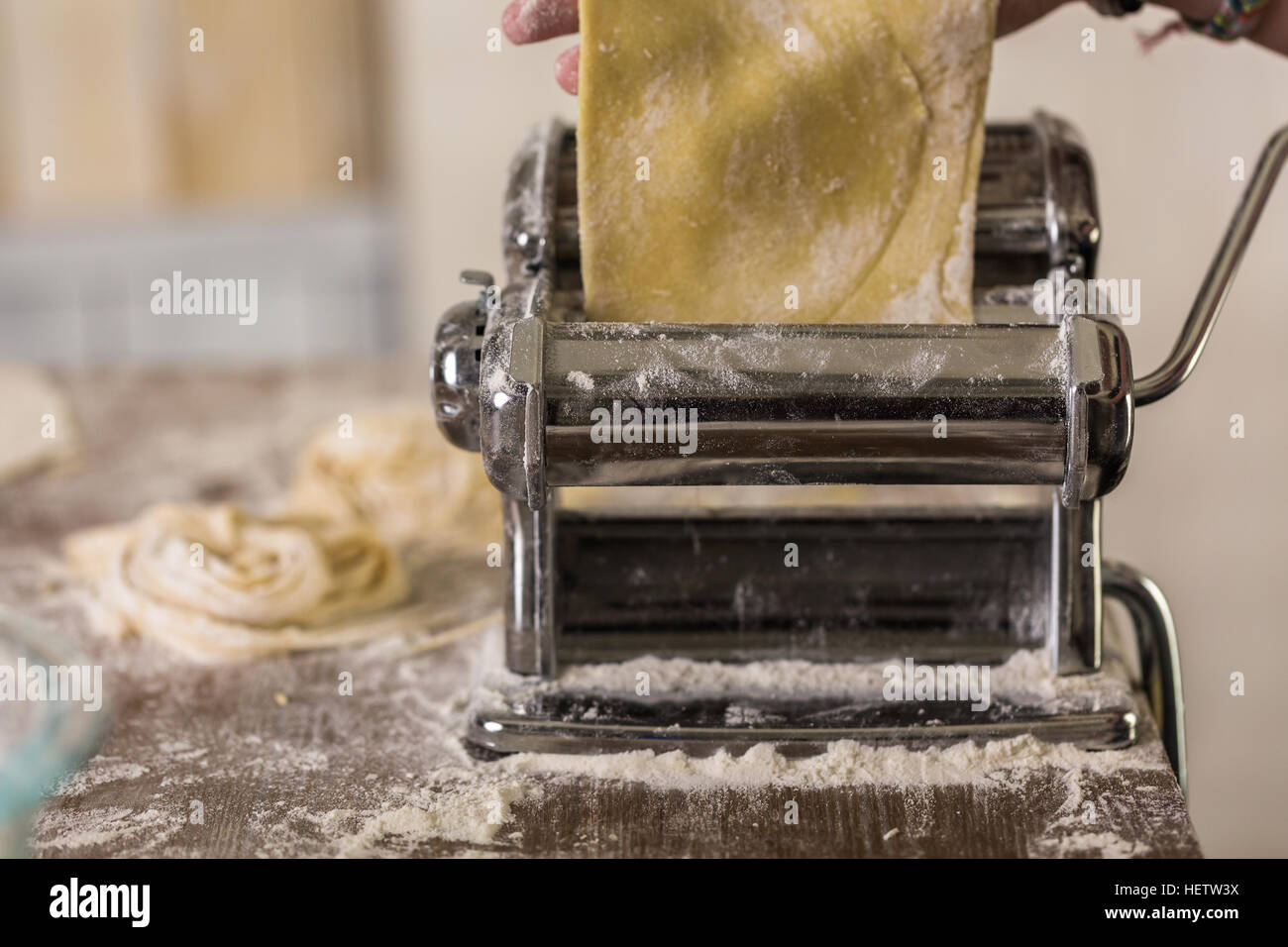 Making Pasta and Tortellini at Home on Wooden Rack and Chrome Pasta Maker  Stock Photo - Alamy