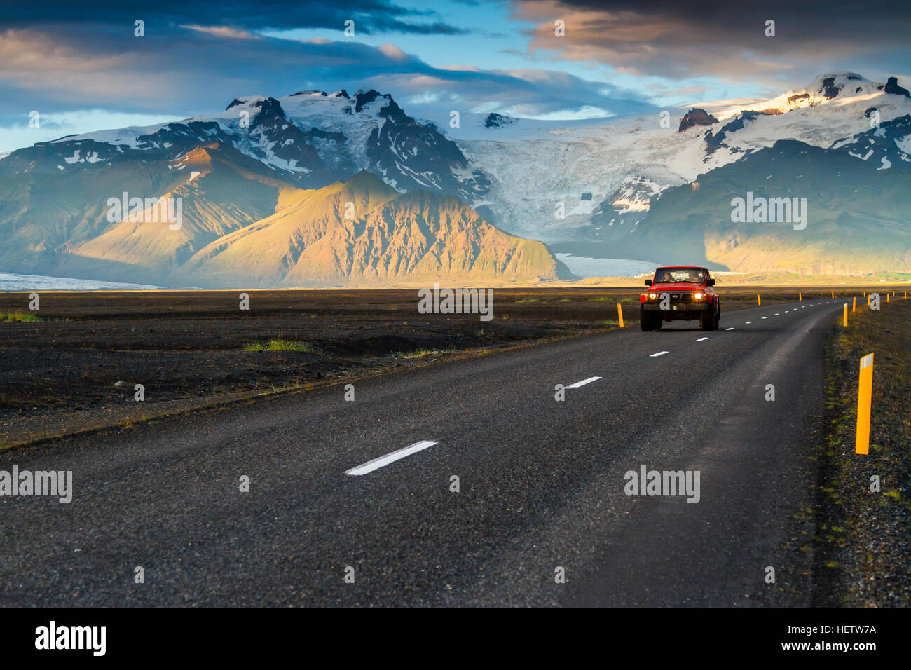 4WD vehicle crossing a mountain landscape. Stock Photo