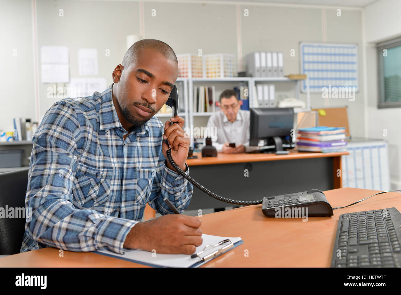 taking-notes-during-a-phone-call-stock-photo-alamy