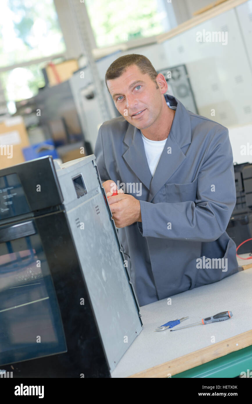 fixing an oven Stock Photo Alamy