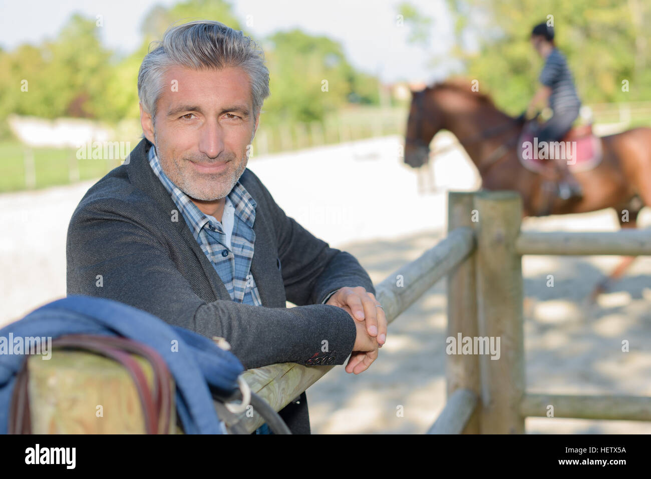 Portrait of man in equestrian arena Stock Photo