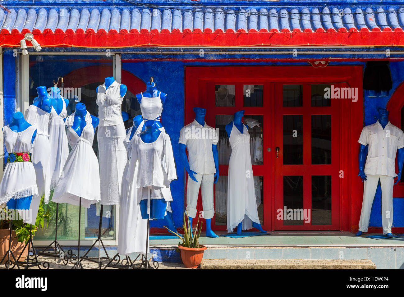 Shop painted red, white and blue selling only white linen and cotton clothing, 5th Avenue, Playa Del Carme, Riviera Maya, Mexico Stock Photo