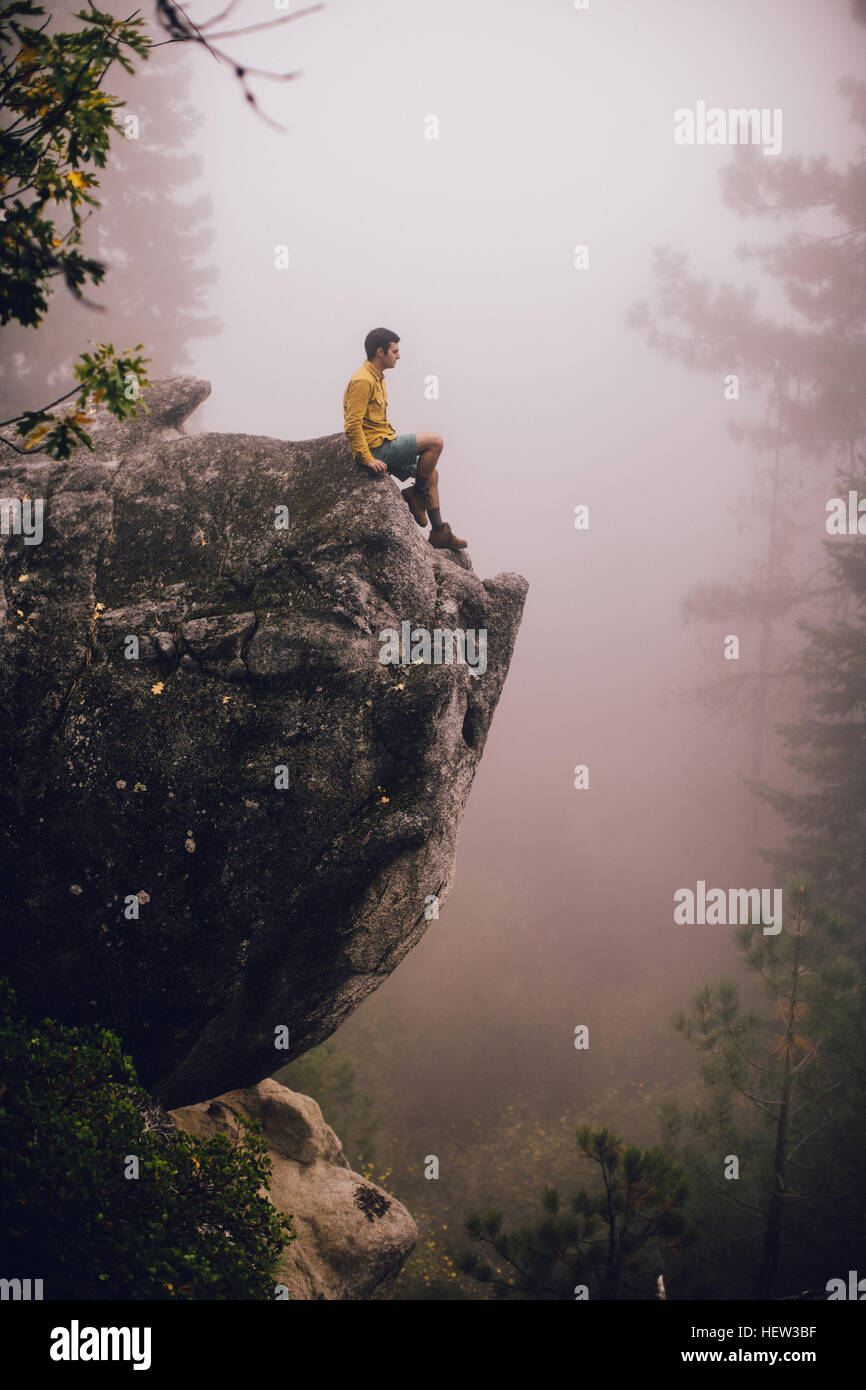 Man sitting rock hi-res stock photography and images - Alamy