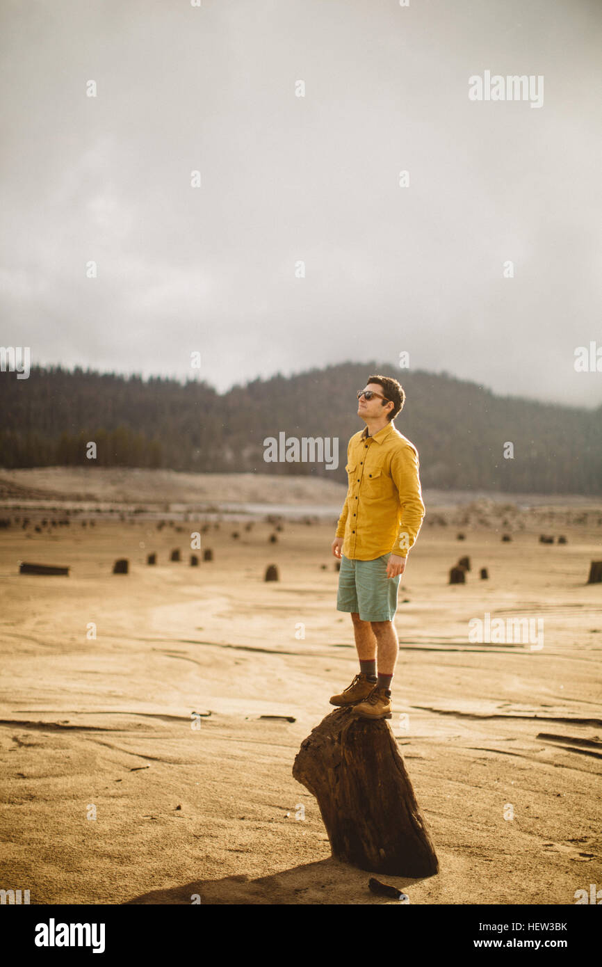 Portrait of young man standing on wood, Huntington Lake, California, USA Stock Photo