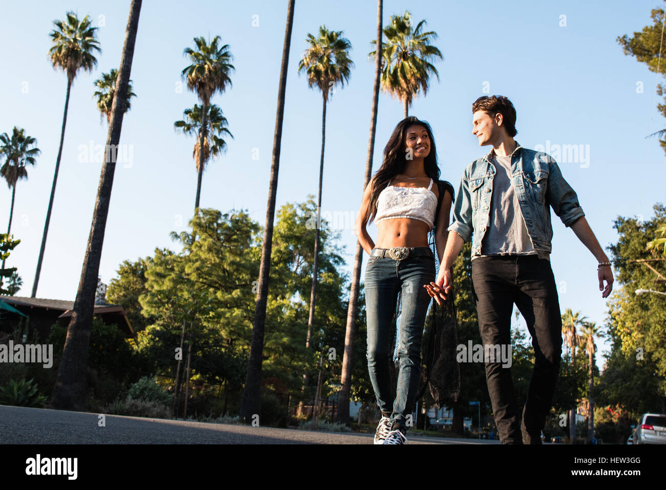 Young couple walking holding hands hi-res stock photography and images ...