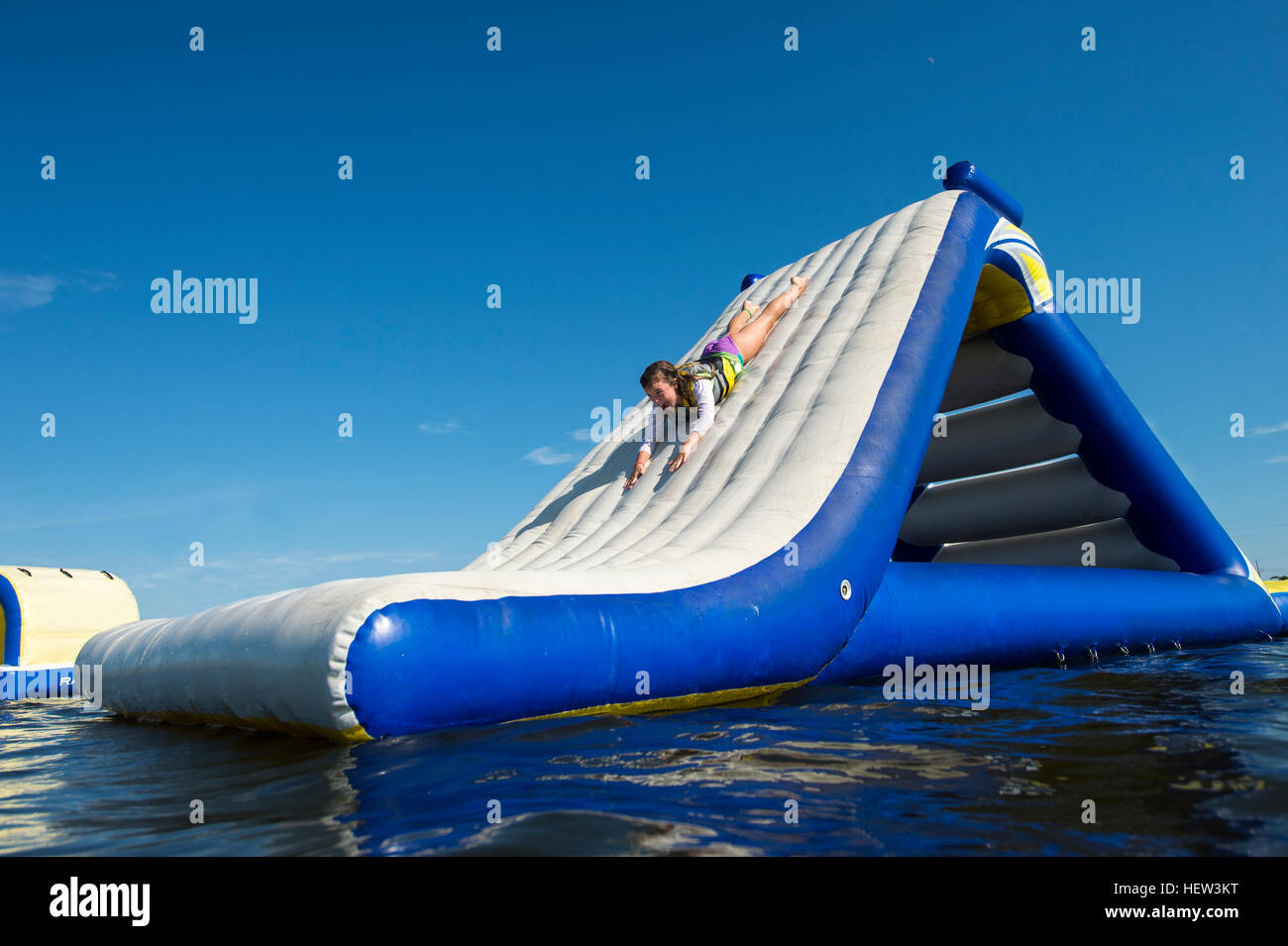 Girl playing on inflatable slide, Seaside Heights, New Jersey, USA Stock Photo