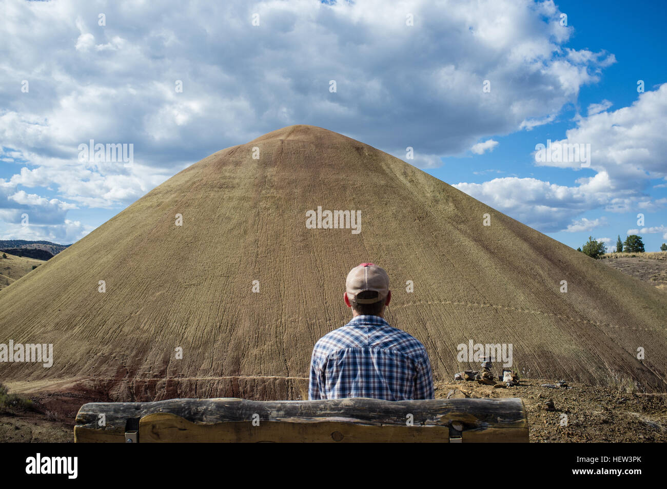 Rear view of man looking at mound, Painted Hills, Oregon, USA Stock Photo