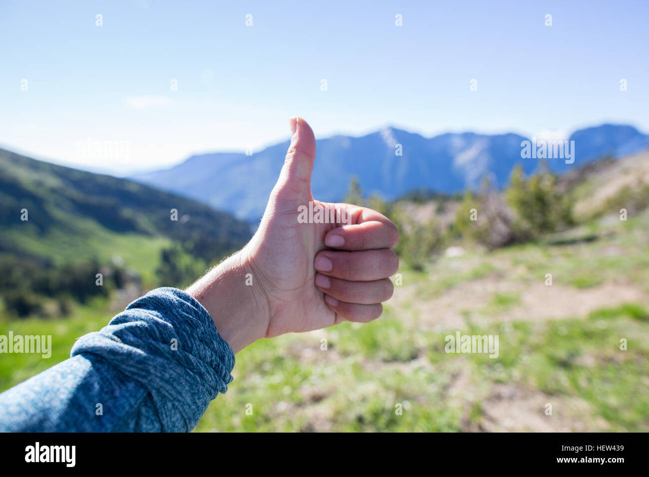 Hiker showing thumbs up for view in background, Enchantments, Alpine Lakes Wilderness, Washington, USA Stock Photo