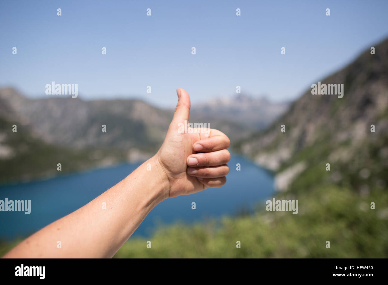 Young woman giving thumbs up, close-up, The Enchantments, Alpine Lakes Wilderness, Washington, USA Stock Photo