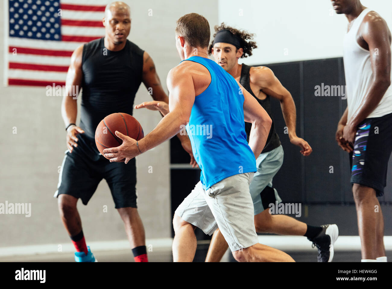 Male basketball player running with ball in basketball game Stock Photo Alamy